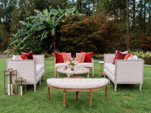 linen sofas and chairs on grass