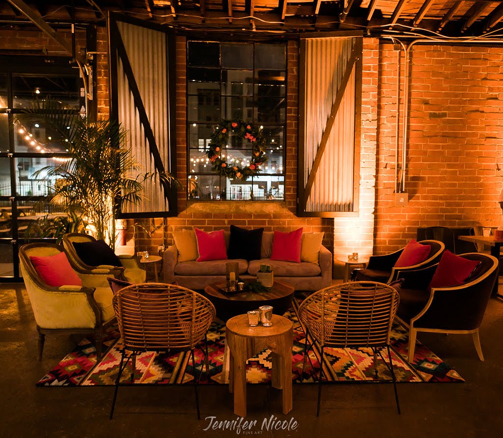 colorful lounge in front of brick wall