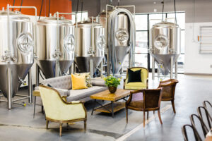 sofa and chairs in front of brewery